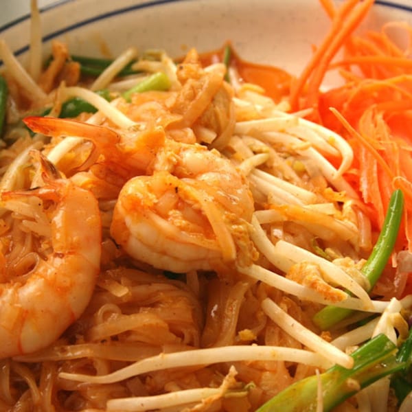 Close-up of Mr. Thai's Pad Thai with shrimp, noodles, bean sprouts, and shredded carrots.